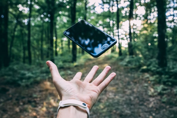 Photo by Stanislav Kondratiev on Unsplash throwing iphone in forest