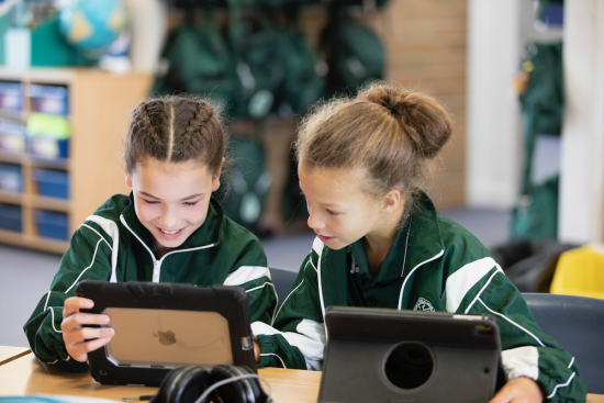 education girls on laptops