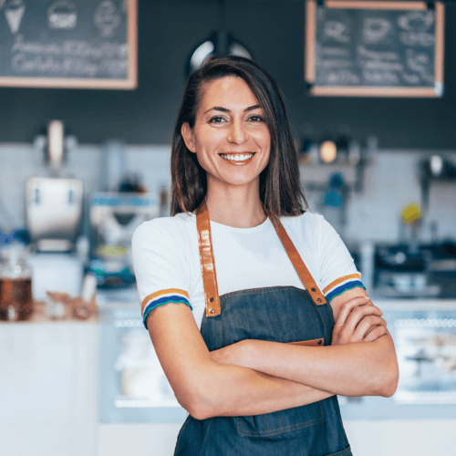 woman arms folded in front of counter retai squarel