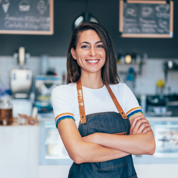 woman arms folded in front of counter retai squarel