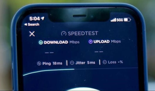 smartphone with speed test on screen