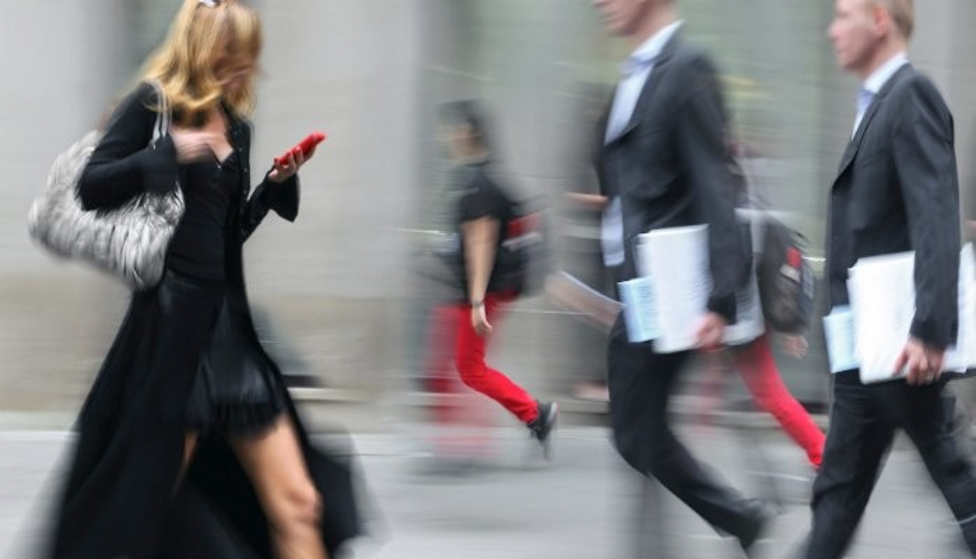 woman walking with mobile red